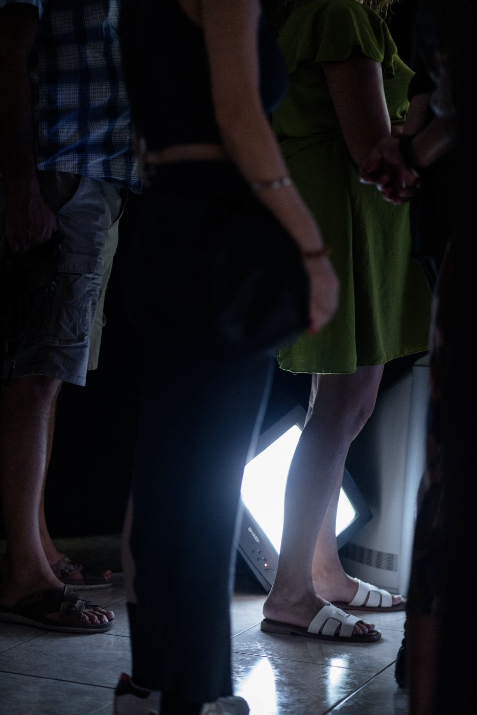 Limen installation detail with visitors and CRT light